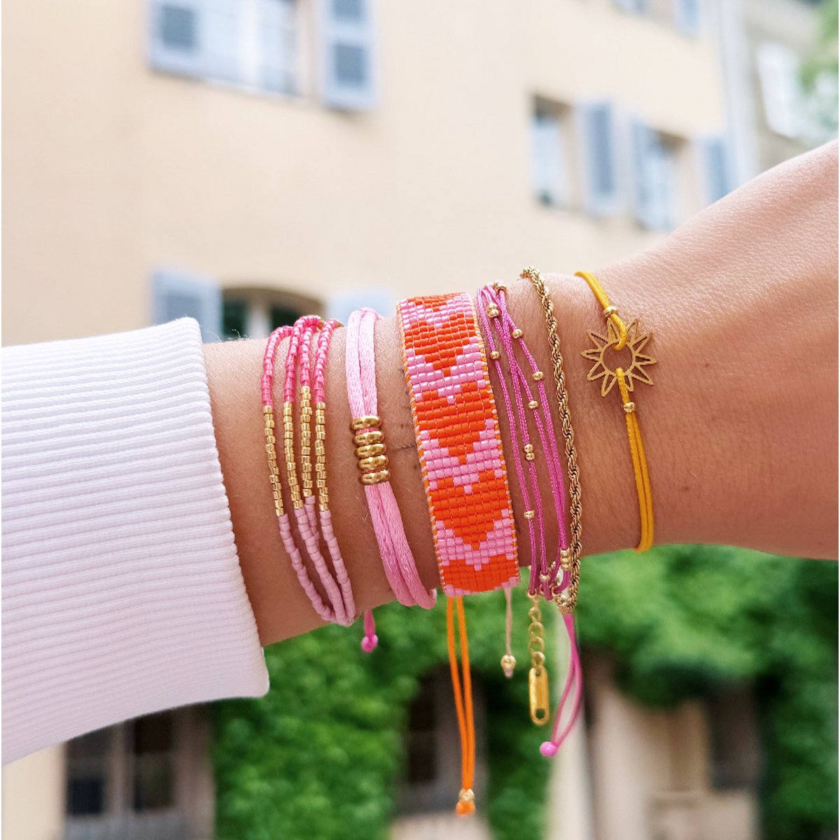BAZOU RVS Weef armband met harten - roze/oranje