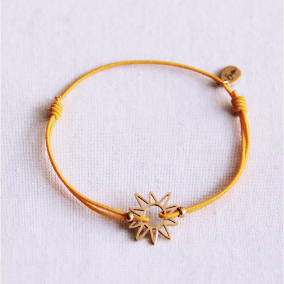 Elastische armband met zon - geel