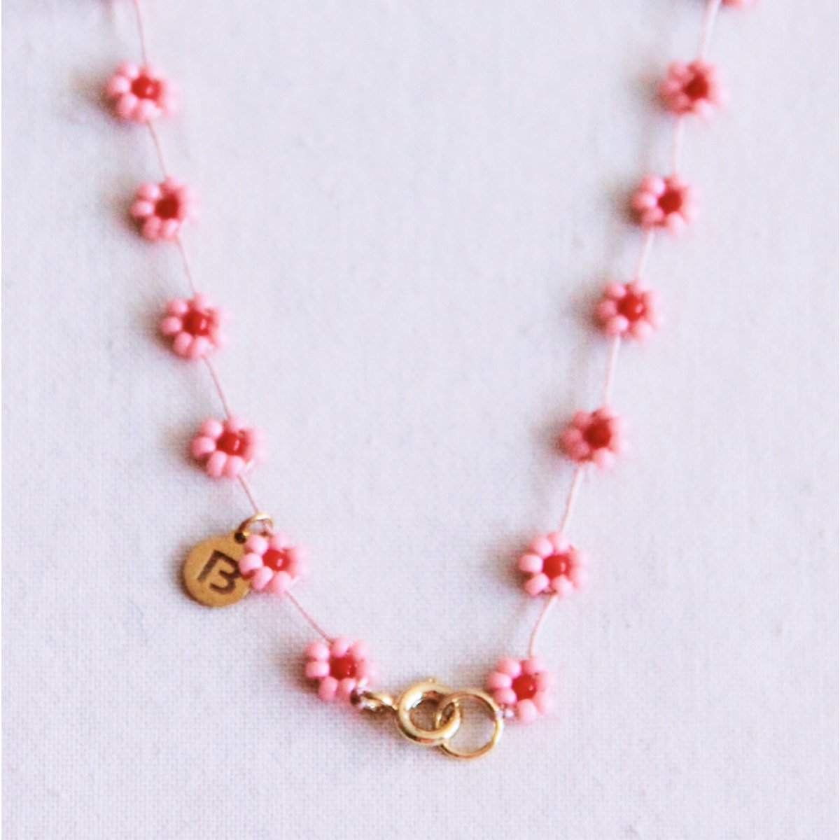 BAZOU RVS Daisy bloem ketting - roze/rood