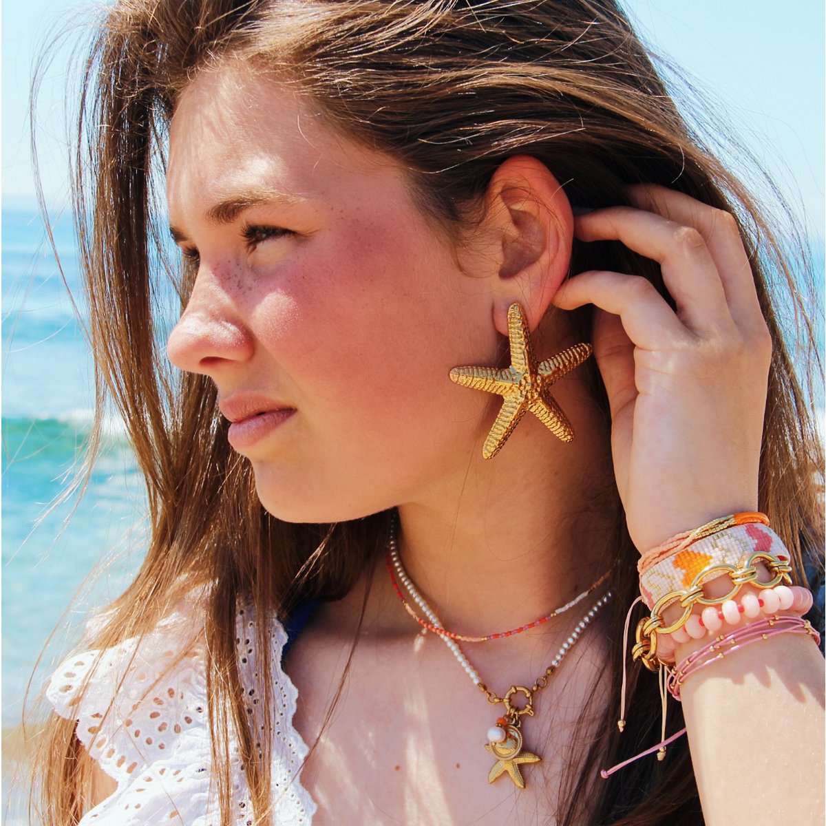 Elastische armband met edelstenen - lichtroze/rood