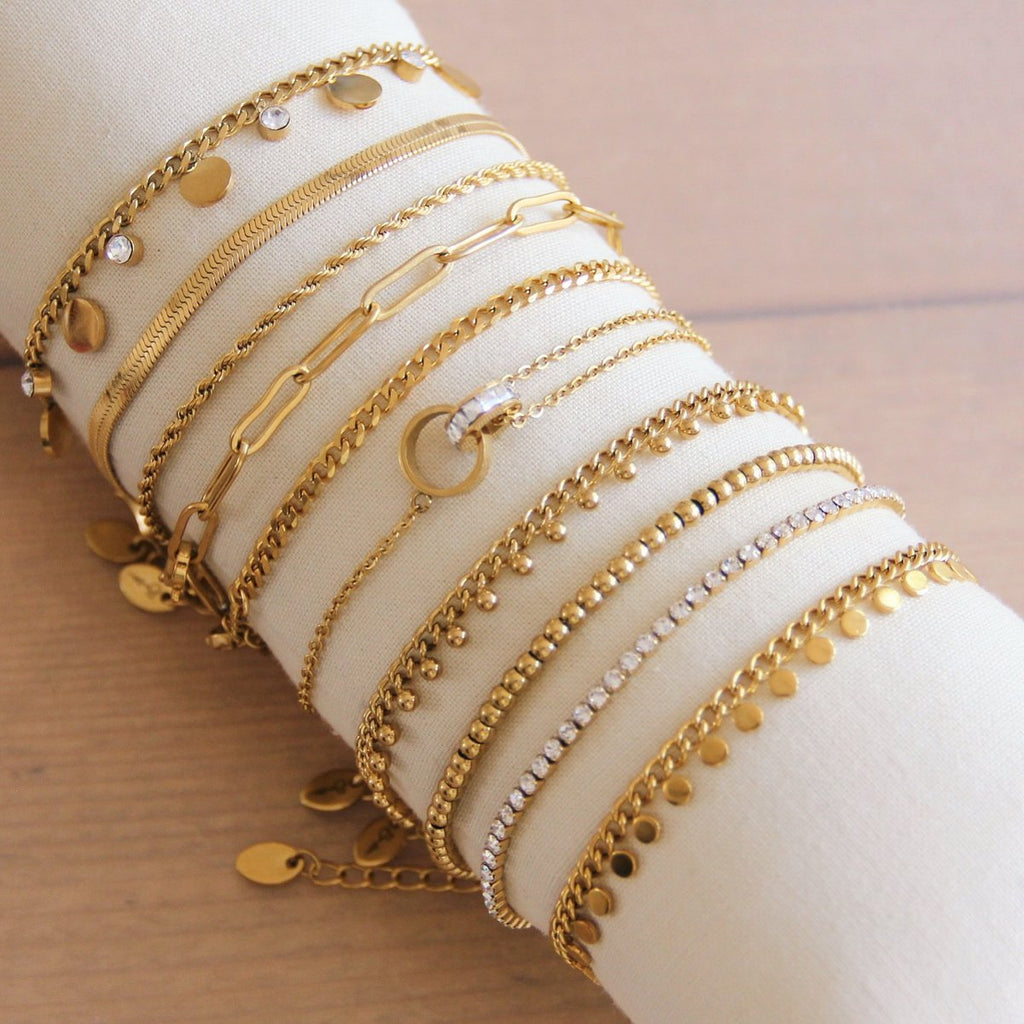 BAZOU SA832: Stalen schakelarmband met muntjes - goud