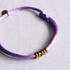 BAZOU Satijnen armband met ringen – lila/goud