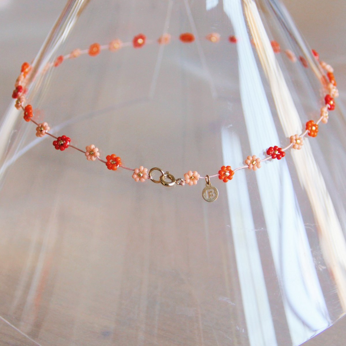 BAZOU RVS ketting met madeliefjesbloem – Mix rood/roze