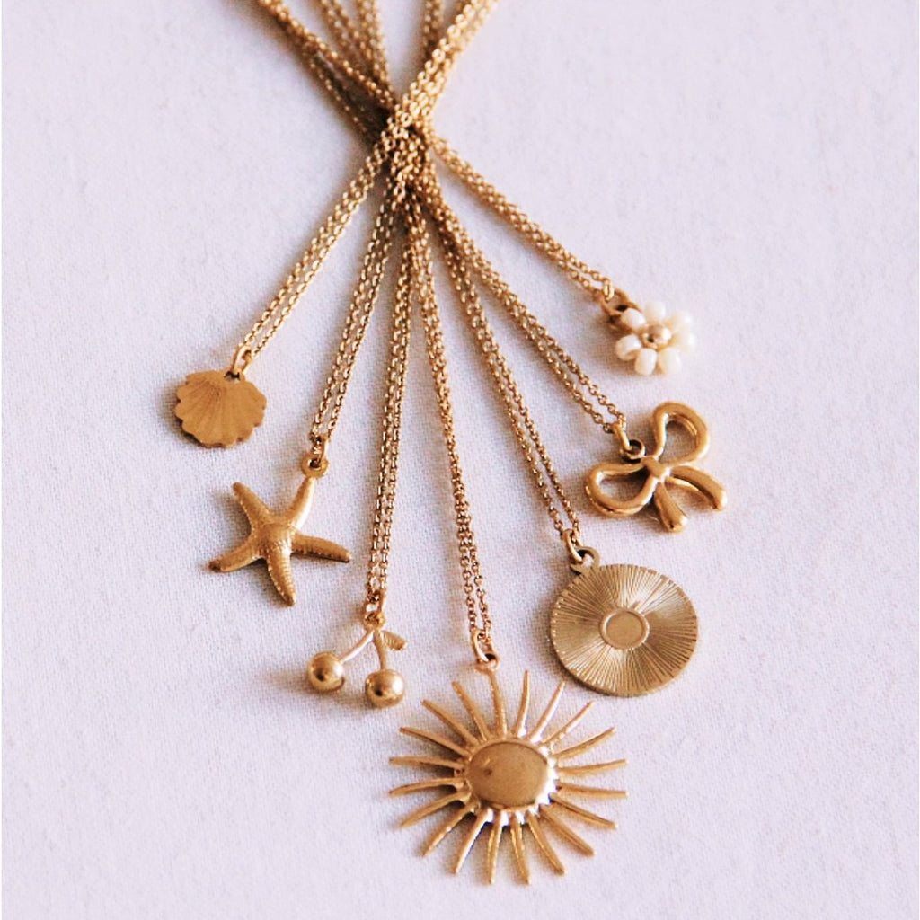 Fijne ketting met madeliefje bloem - crème