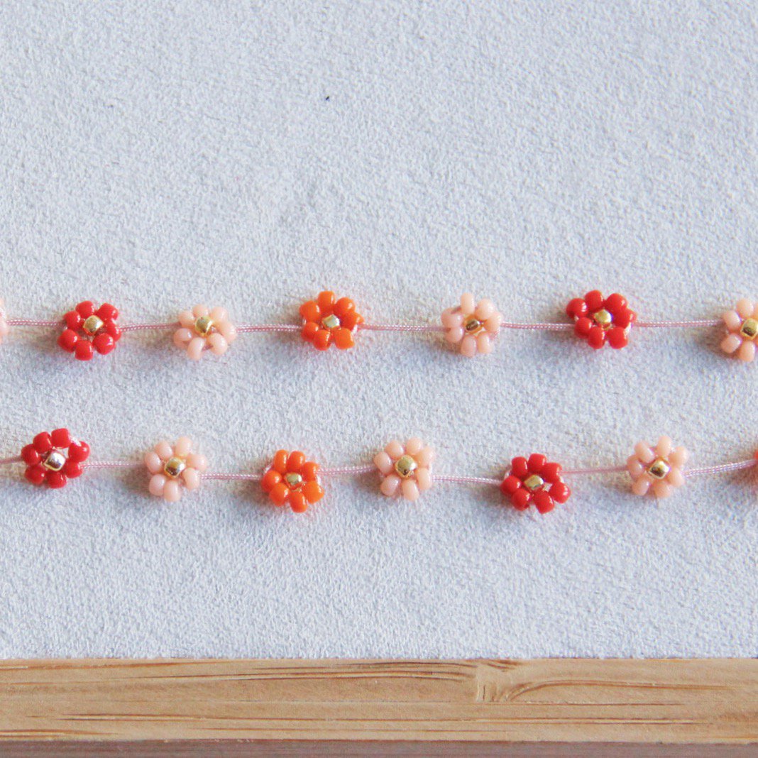 BAZOU RVS ketting met madeliefjesbloem – Mix rood/roze
