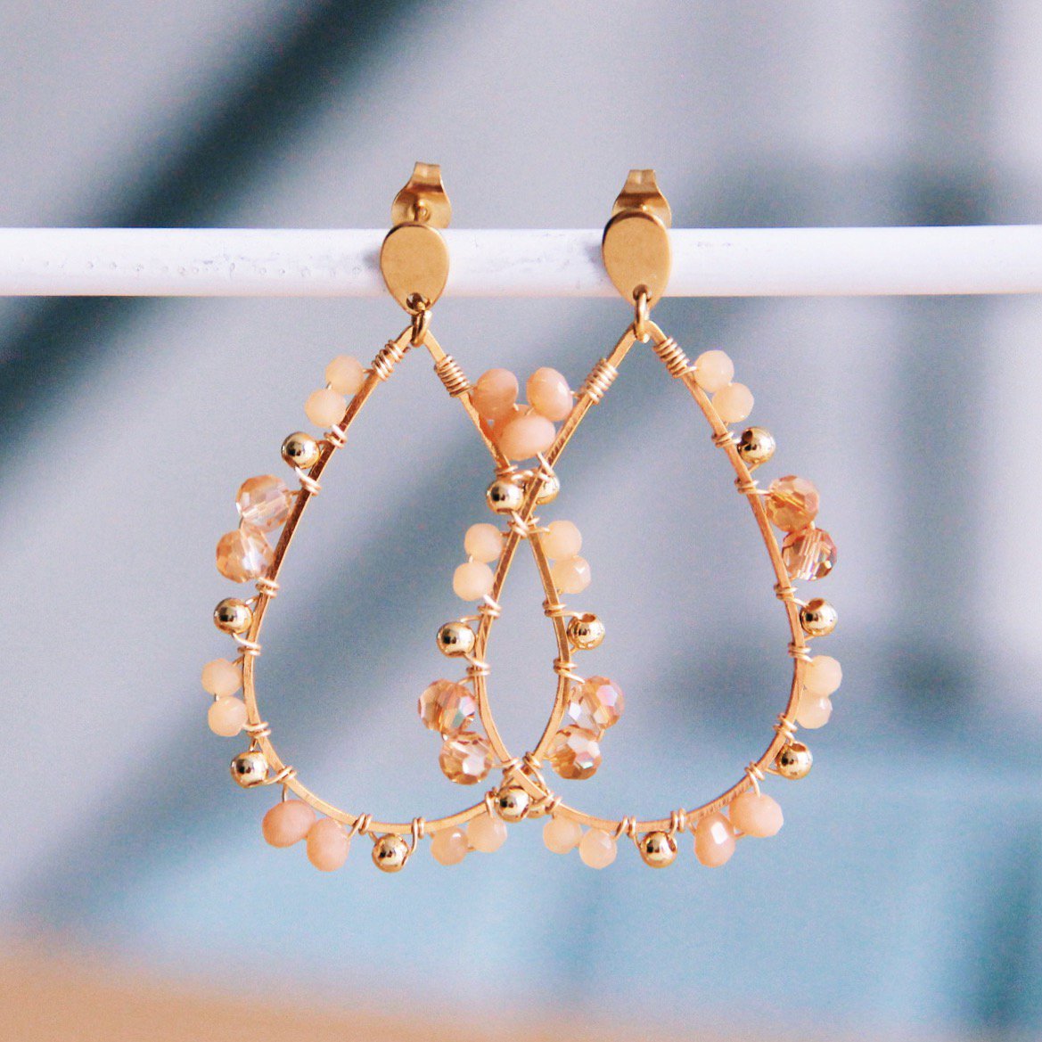 Druppel oorrang met facetten - oranje/perzik