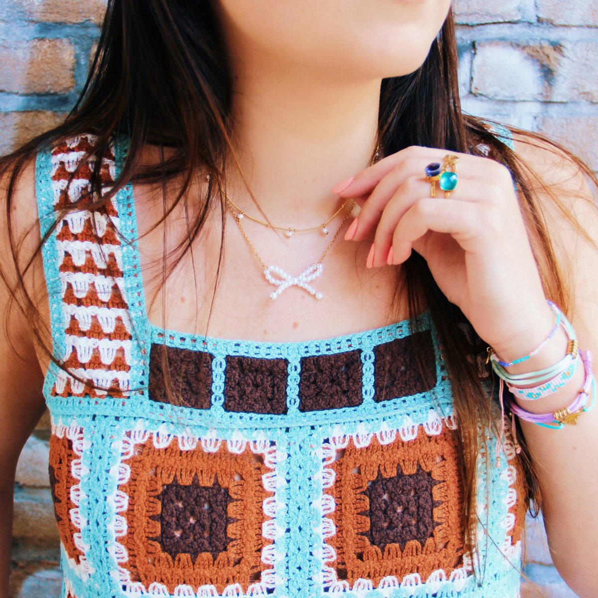 Edelstalen fijne ketting met parelstrik - goud