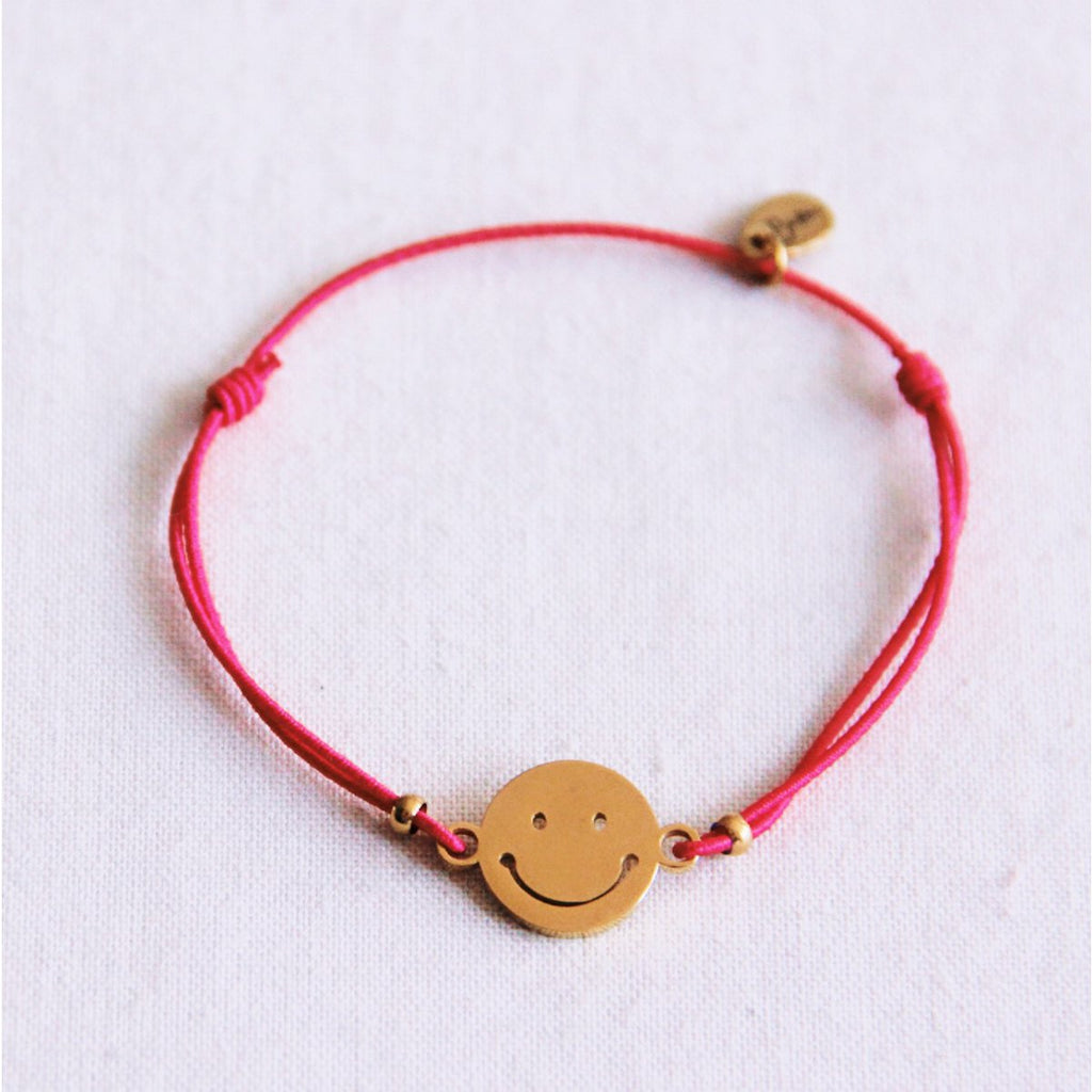 Elastische armband met smiley - fuchsia