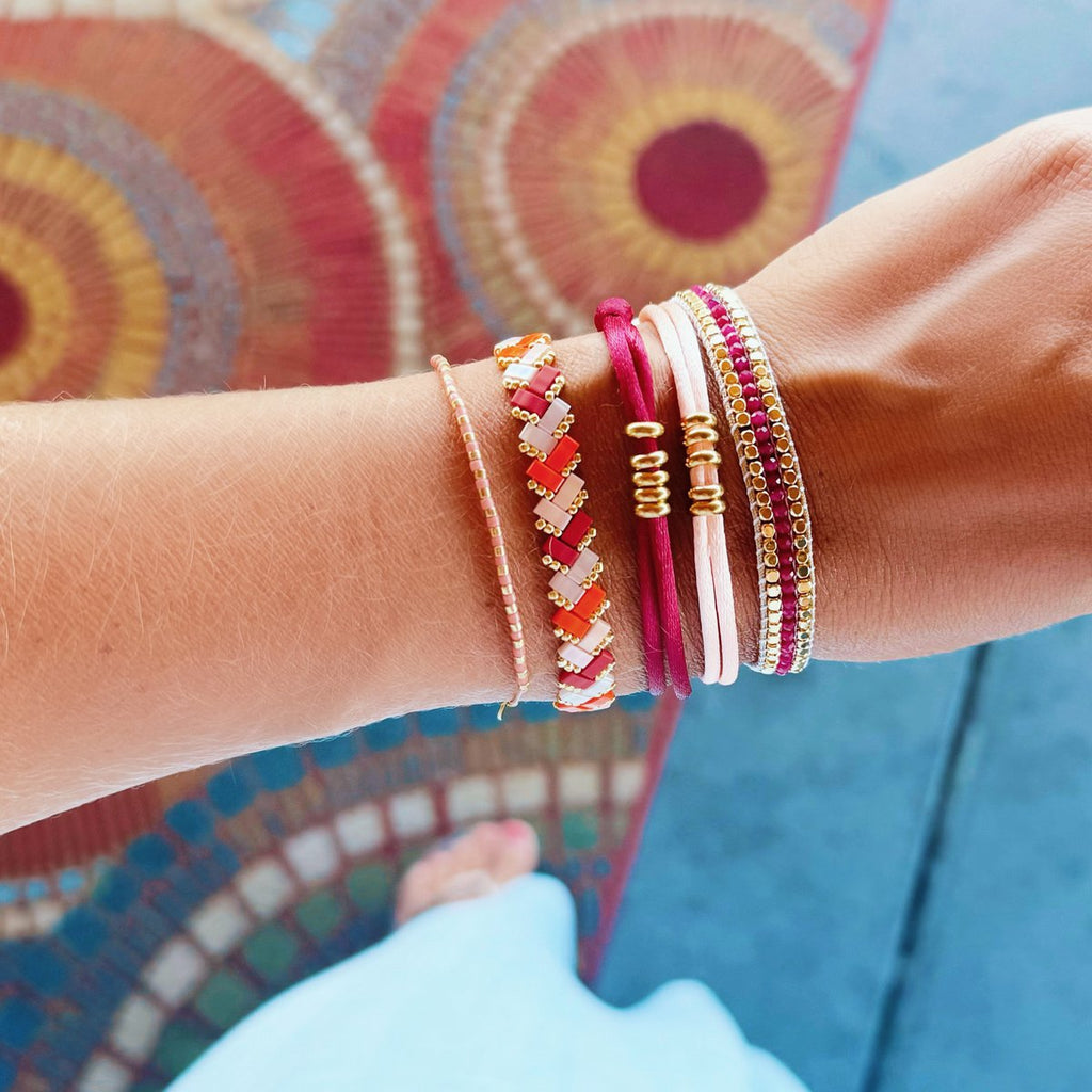 Gevlochten Tila kralenarmband - Zalm/Oranje/Bordeaux