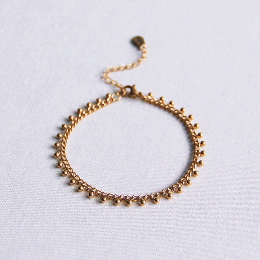 BAZOU Stalen schakelarmband met balletjes - goud