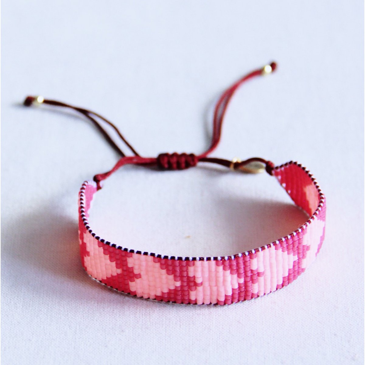 Hart geweven armband - roze/fuchsia