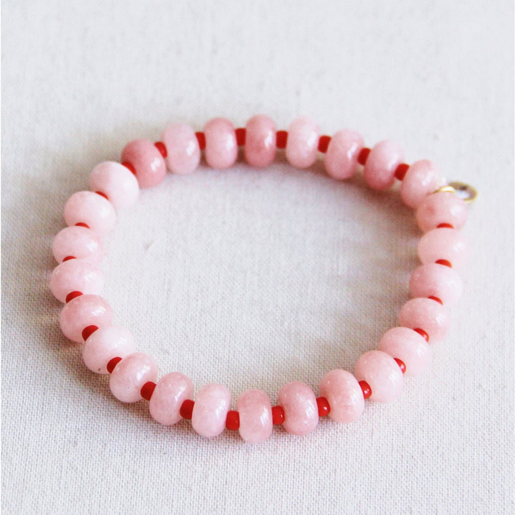 Elastische armband met edelstenen - lichtroze/rood